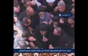 آیت‌الله حکیم بر پیکر رهبر شهید مقاومت نماز خواند